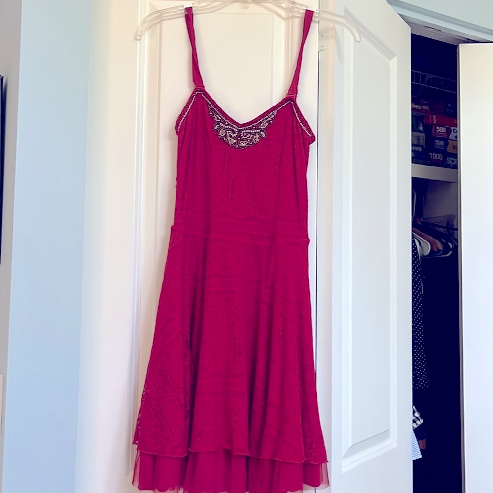 Free people red dress with lace and beaded details. Lined. Removable straps.